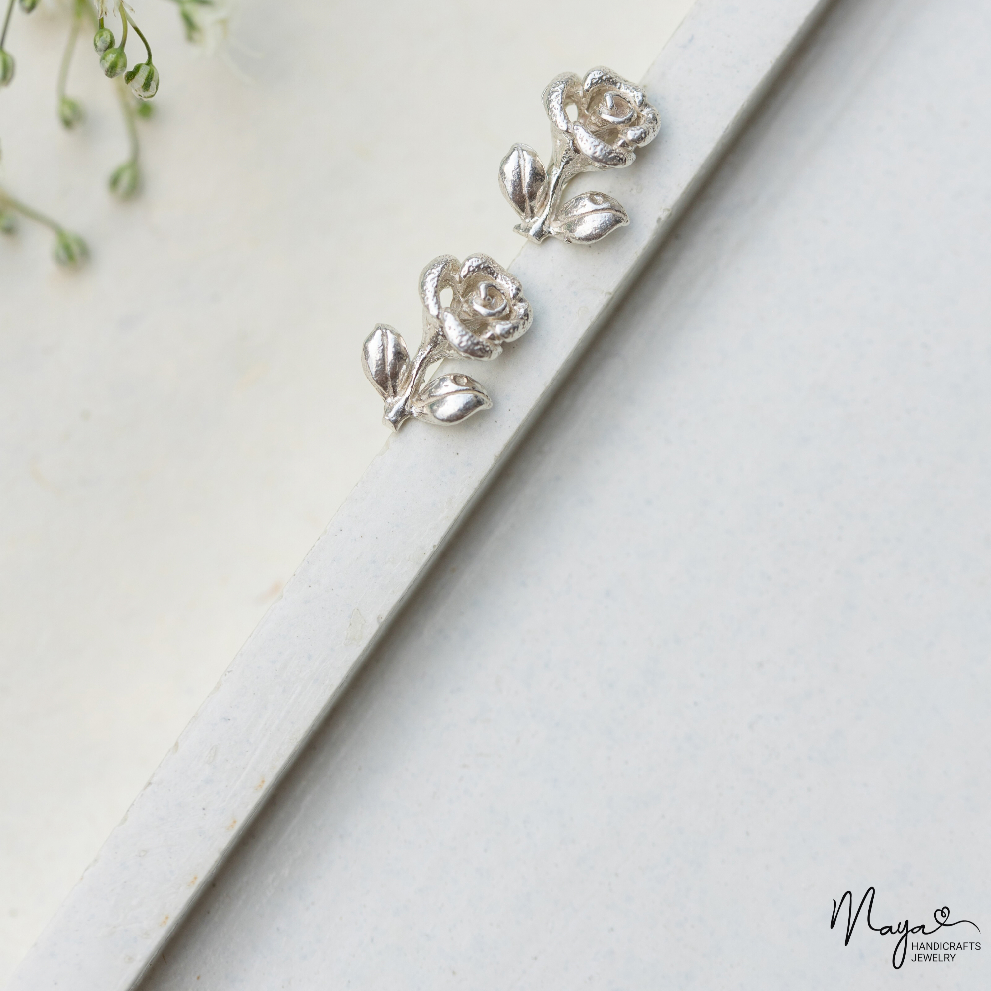 Rose with leaf studs